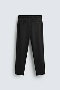TEXTURED PLEATED PANTS