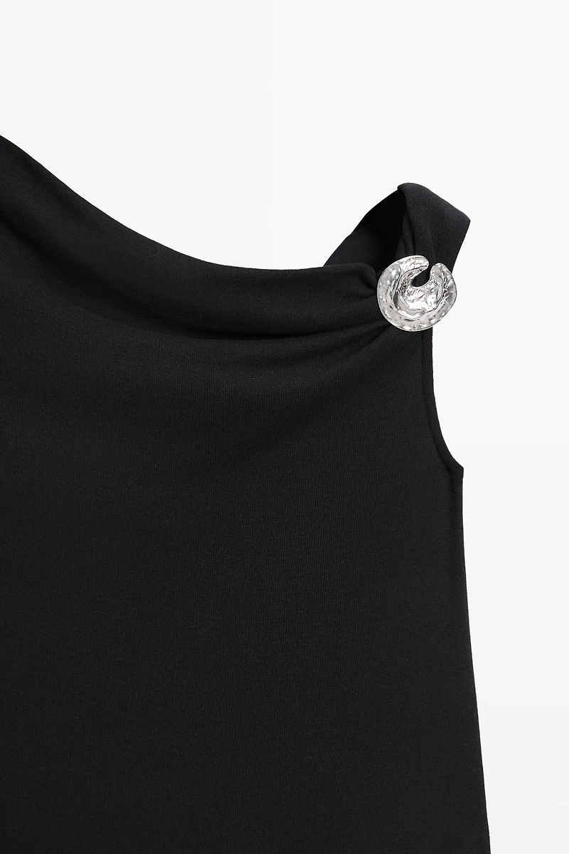 Top asymétrique détail bijou