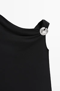 Top asymétrique détail bijou