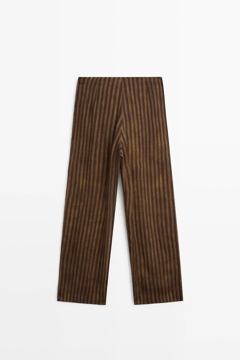 Total look flowing striped pants with button hem
