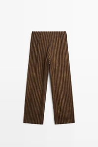 Total look flowing striped pants with button hem