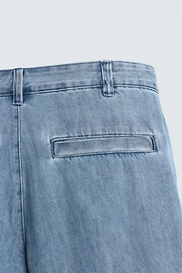 RELAXED FIT PLEATED DENIM SHORTS