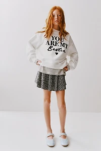 FLOCKED TEXT SWEATSHIRT