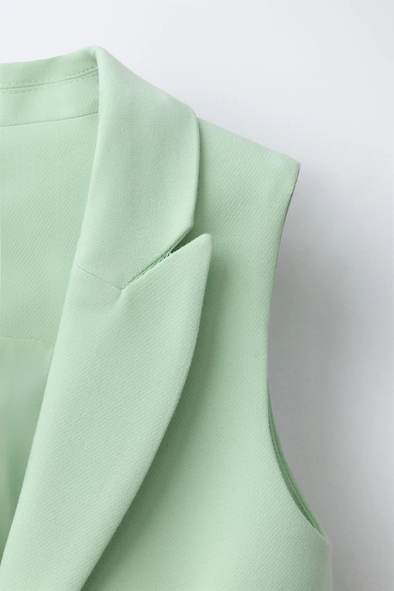 GILET LONG BOUTON BIJOU