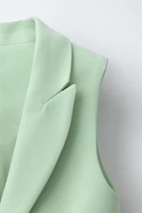 GILET LONG BOUTON BIJOU