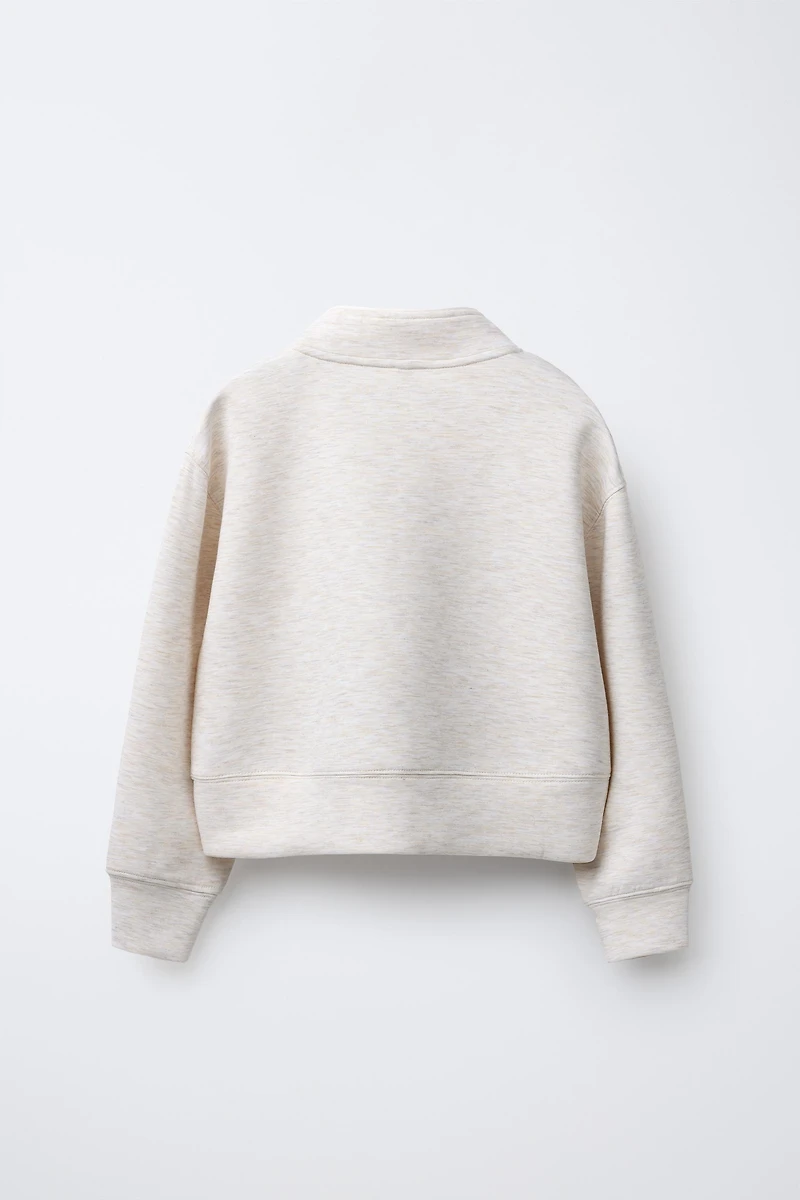 RAISED TEXT SWEATSHIRT