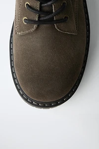 BOTTINES EN CUIR À LACETS
