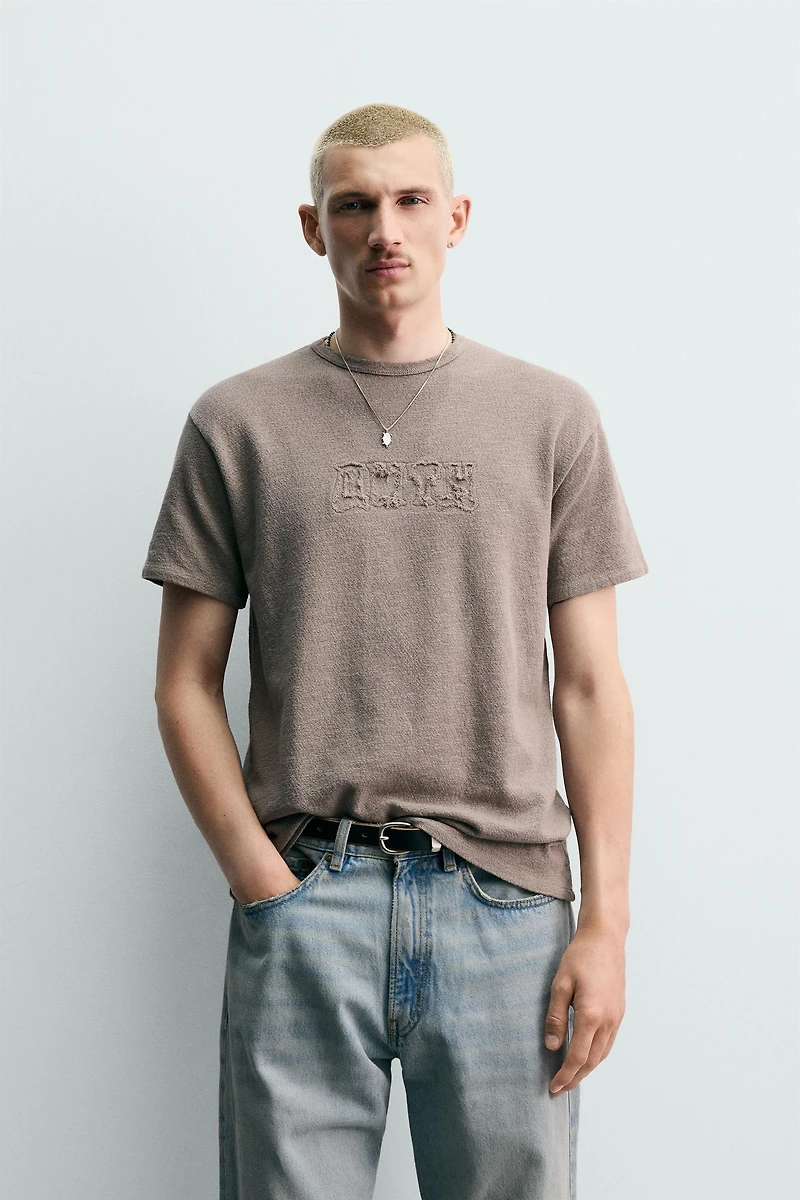 T-SHIRT EN MAILLE LAVÉE À PIÈCES