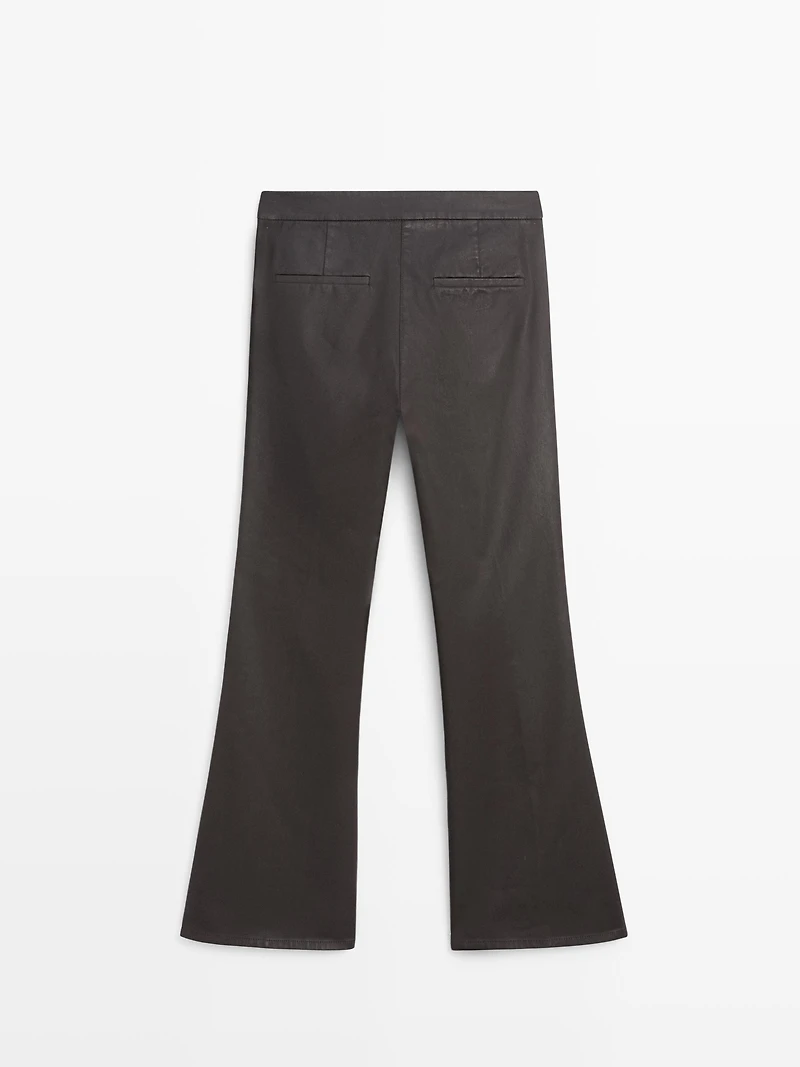Waxed flare fit trousers