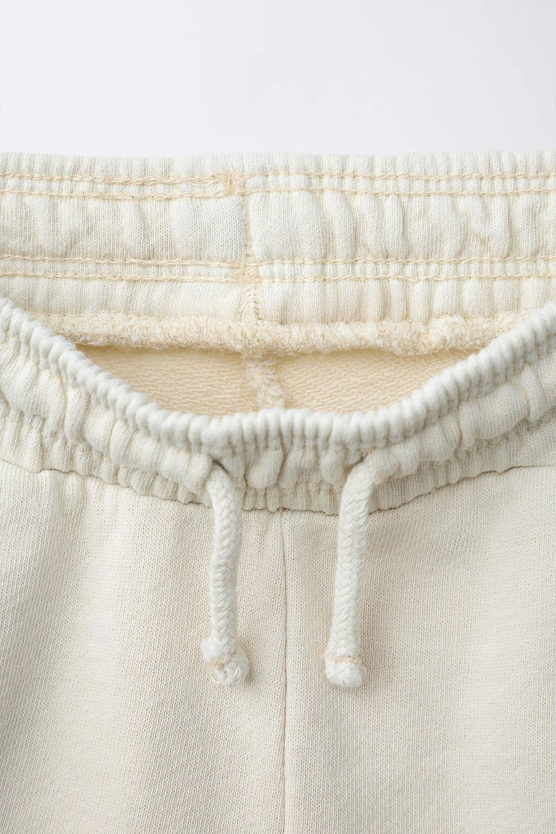EMBROIDERED GARMENT DYED PLUSH SHORTS