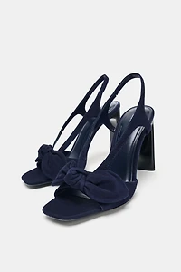 SUEDE BOW HEELED SANDALS