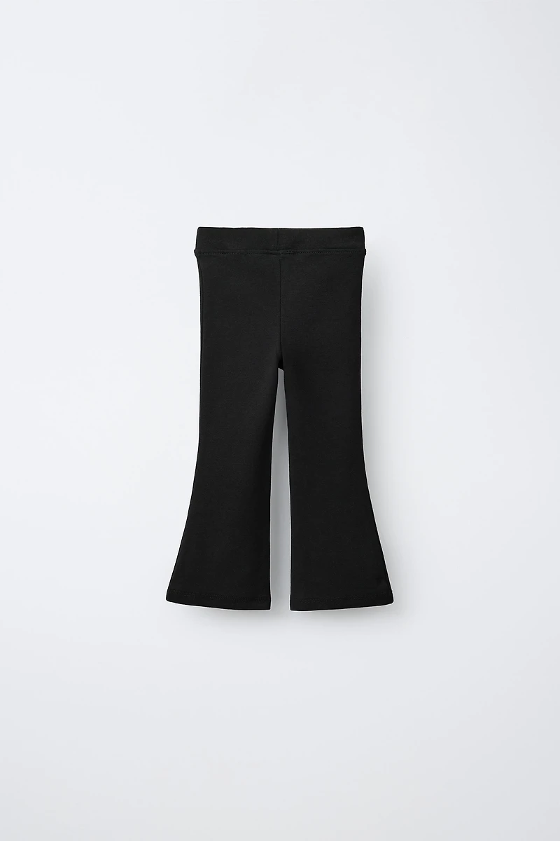 LABEL DETAIL INTERLOCK FLARE LEGGINGS