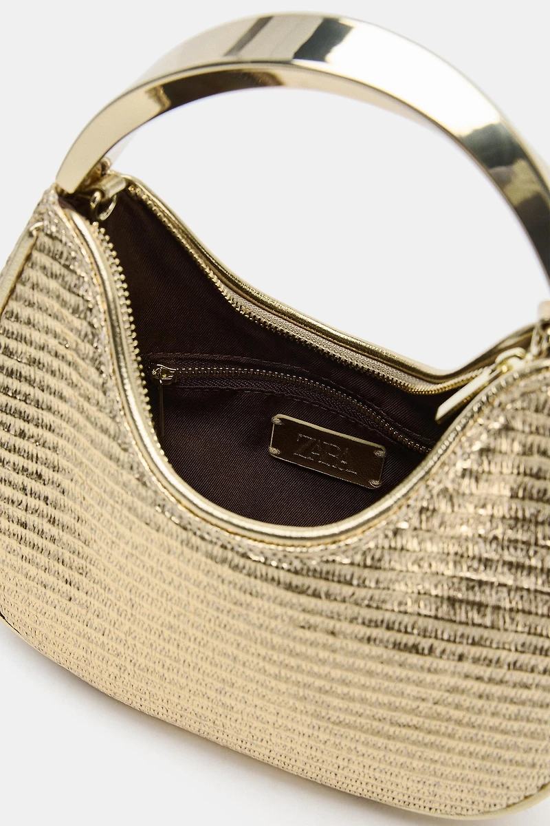 BAG WITH METALLIC HANDLE DETAIL