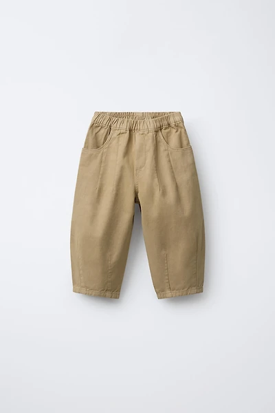 SOFT TOUCH PLEATED BAGGY PANTS