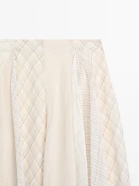 Jupe midi asymétrique à carreaux