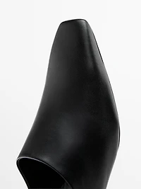 Mules à talon compensé