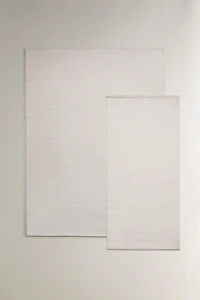 LIGHT-COLORED WOOL AREA RUG