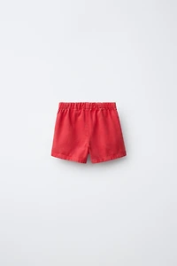 JUPE-SHORT EN SERGÉ À LACETS