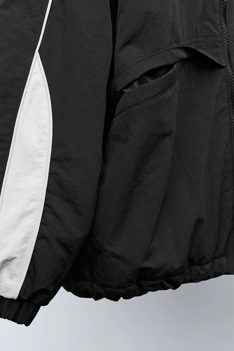 UEFA CHAMPIONS LEAGUE ® WATER REPELLENT JACKET WITH HOODIE