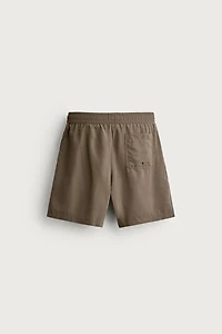 BASIC LONG SWIM TRUNKS