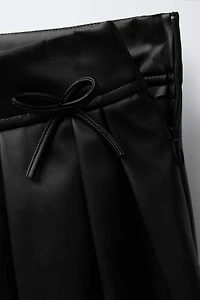 FAUX LEATHER BOX PLEAT SKIRT WITH TIES