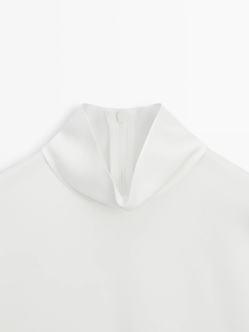 High neck blouse with hem detail