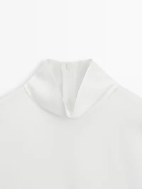 High neck blouse with hem detail