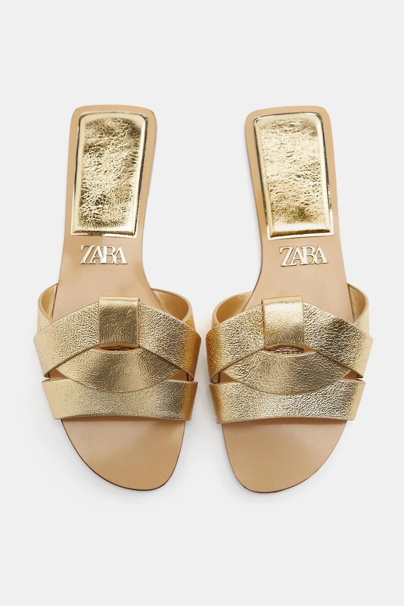 FLAT CROSSED LEATHER SANDALS