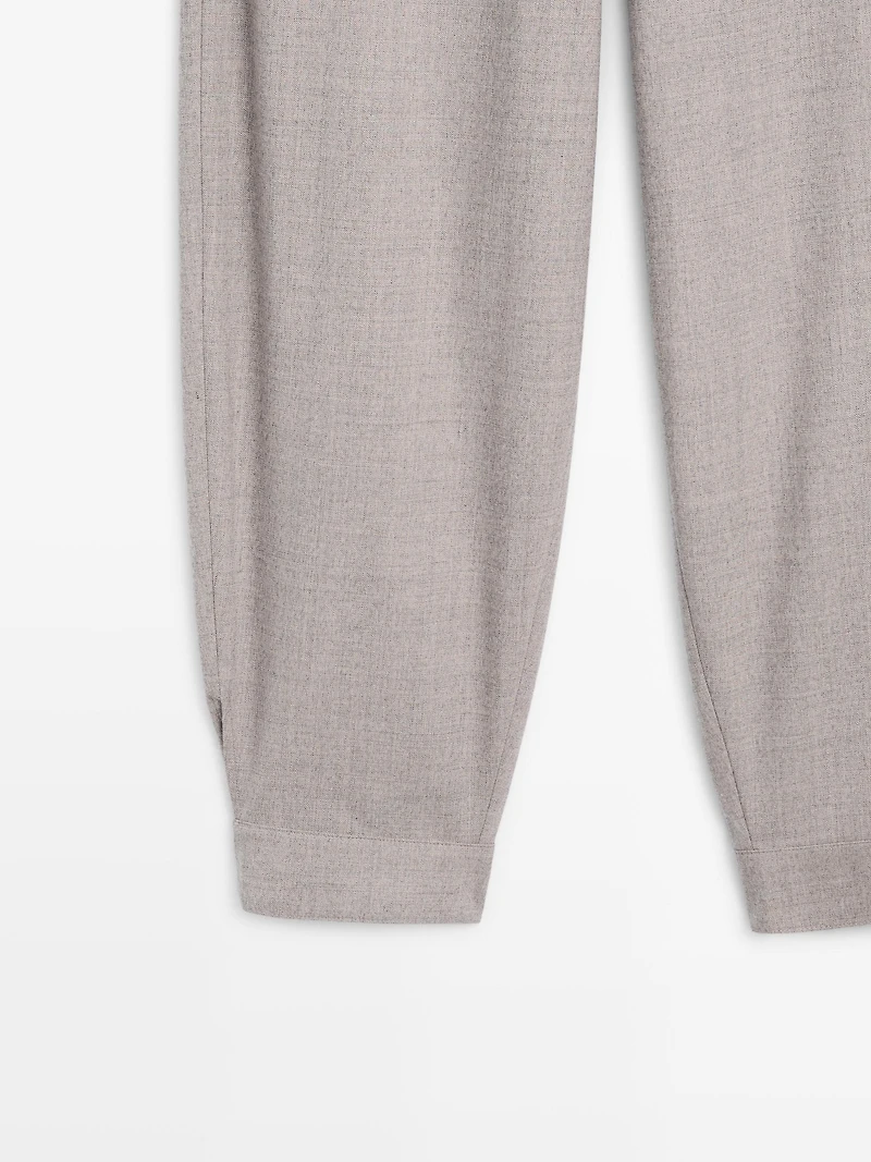 Wool blend trousers with buckle detail