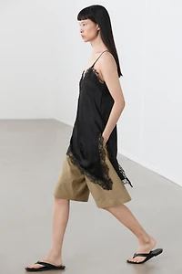 Asymmetric thin strap camisole top