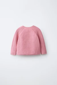 PULL EN MAILLE À PAPILLONS