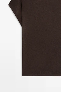 Asymmetric drop sleeve fluid top