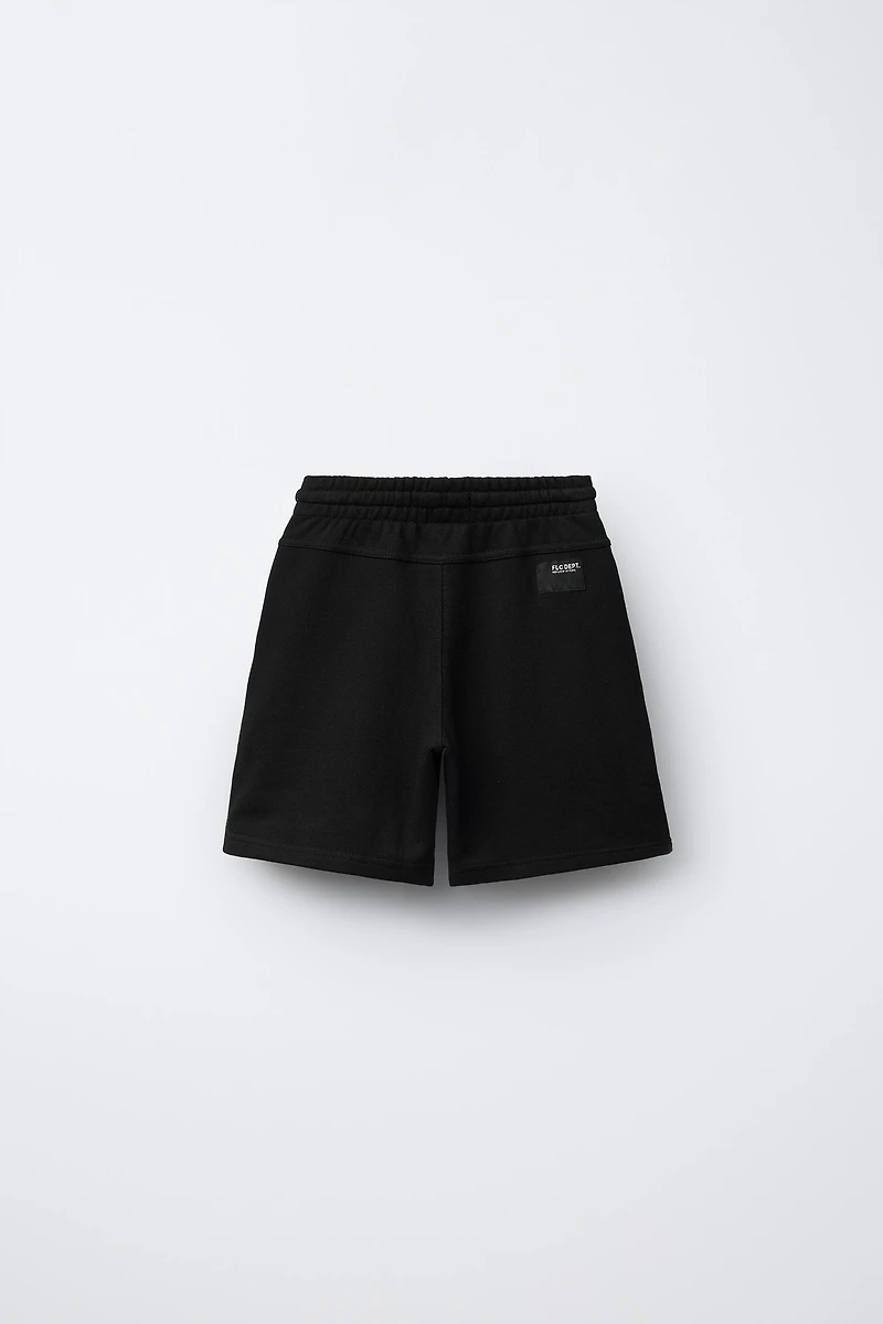STRAIGHT FIT GARMENT DYE PLUSH SHORTS