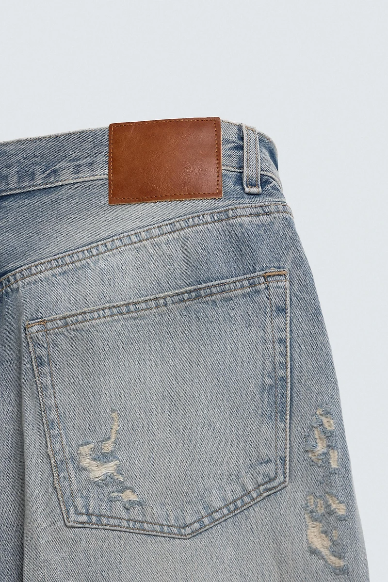 LOOSE FIT RIPPED JEANS