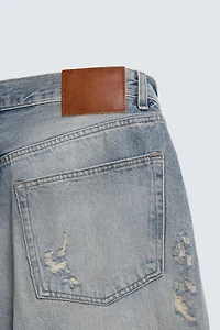 LOOSE FIT RIPPED JEANS