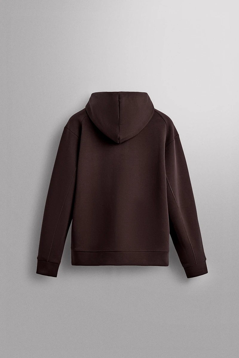 SWEAT TECHNIQUE ZIPPÉ À CAPUCHE