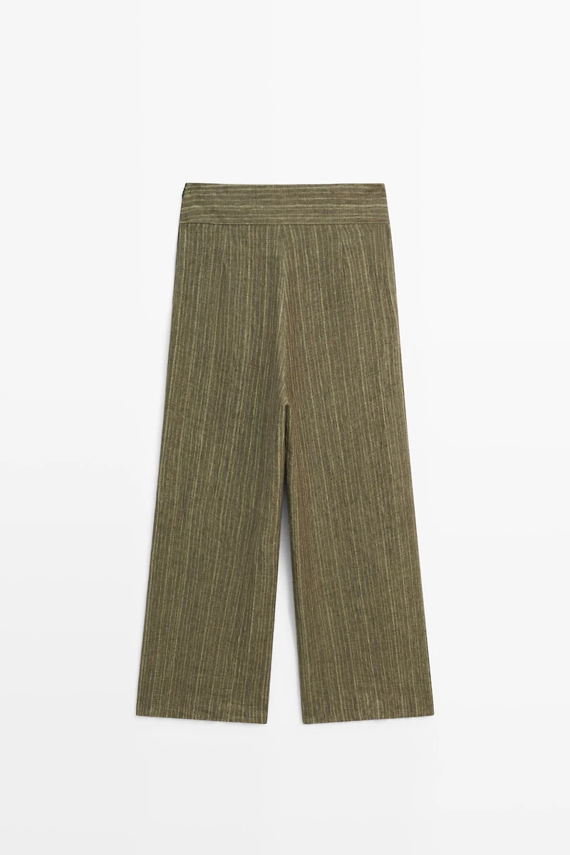 Total look linen trousers with corset belt detail