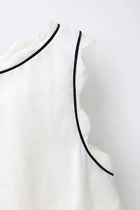 SCALLOPED TOP WITH CONTRAST PIPING