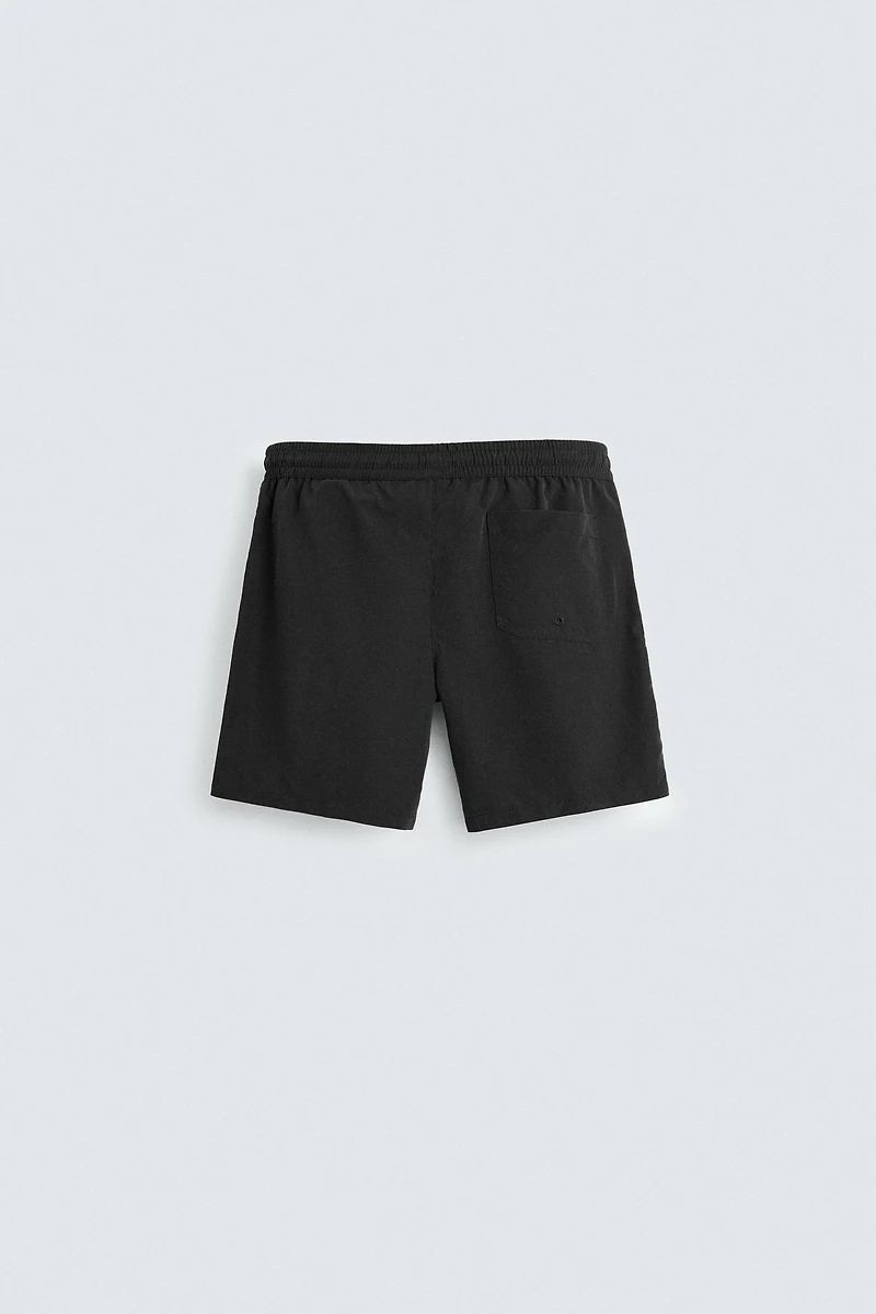 BASIC LONG SWIM TRUNKS