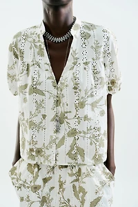 PRINTED TOP WITH EMBROIDERED EYELETS