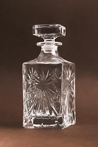 CRYSTALLINE BOTTLE WITH RAISED DESIGN