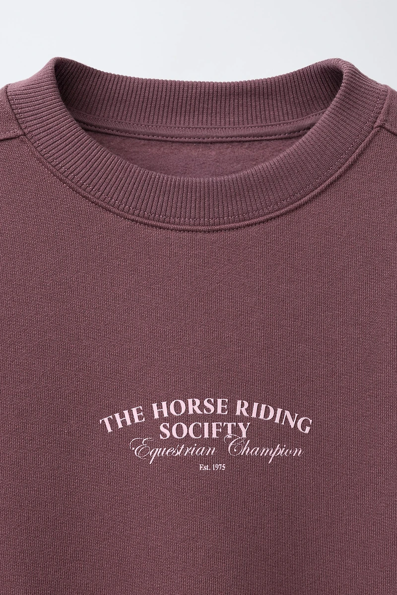 RAISED TEXT SWEATSHIRT