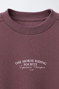 RAISED TEXT SWEATSHIRT