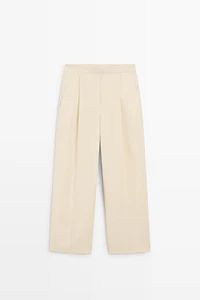 Flowing trousers with pleats