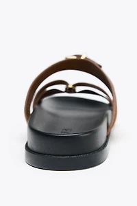 SUEDE CROSSED STRAP SANDALS