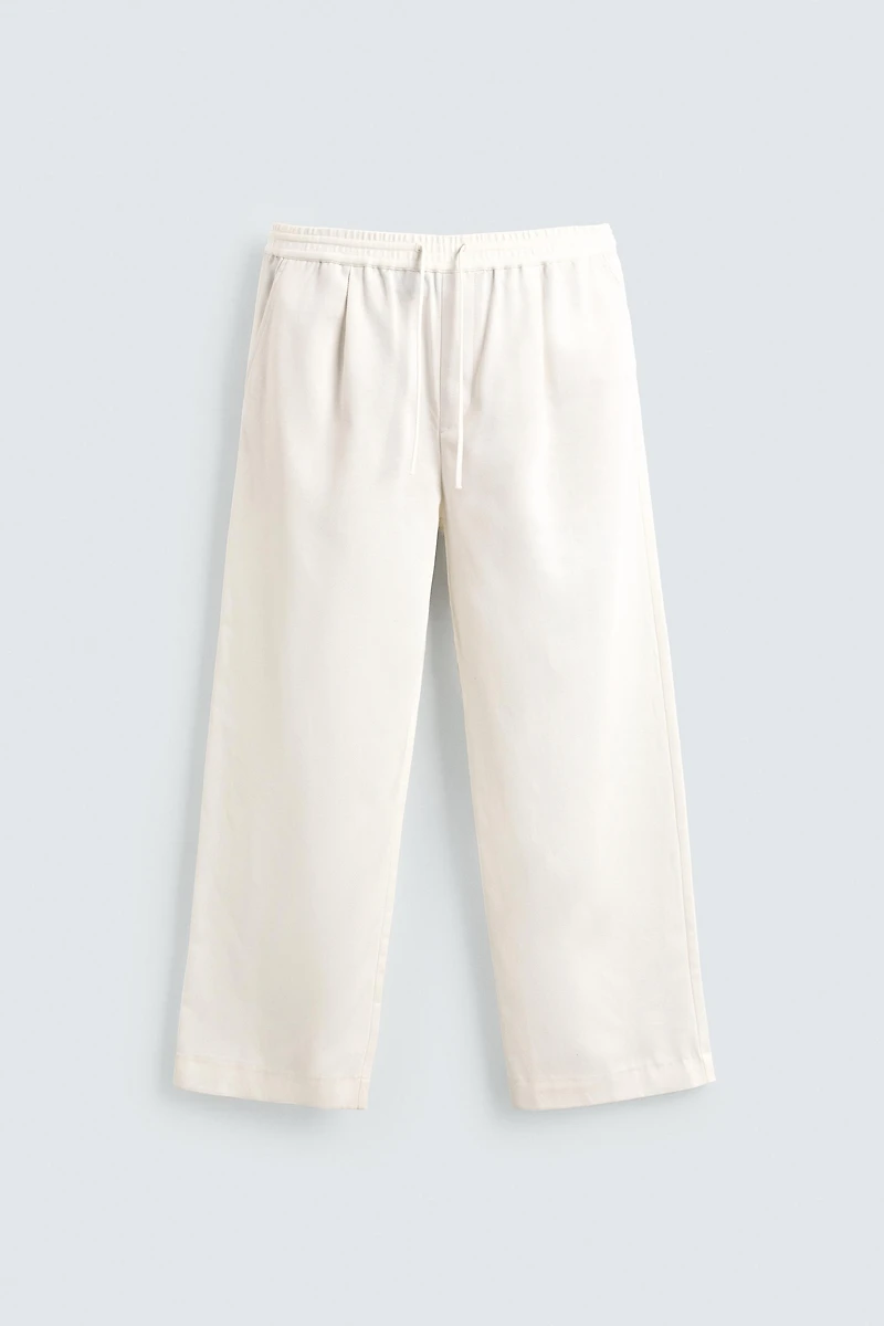 TEXTURED PLEATED PANTS