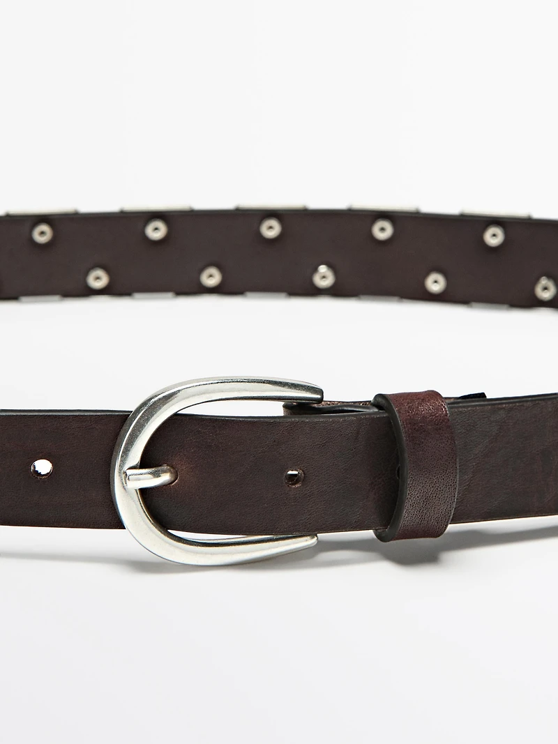 Belt with metal appliqués