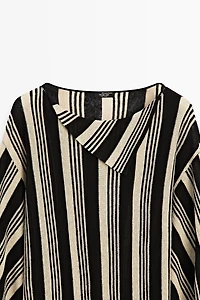 Pull en maille style tunique rayé