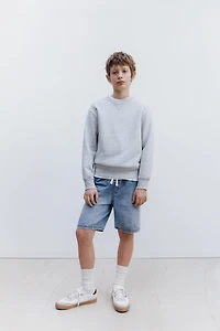 BERMUDA EN JEAN AMPLE