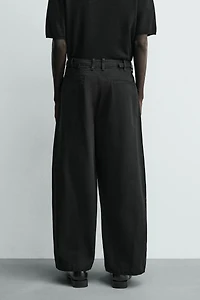 RELAXED BALLOON FIT PLEATED PANTS